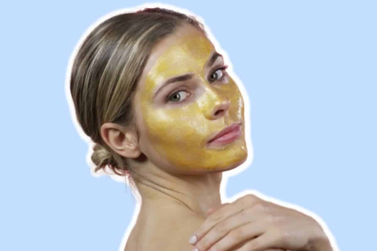 woman with a gold facial