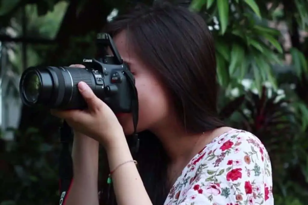 girl holding a camera